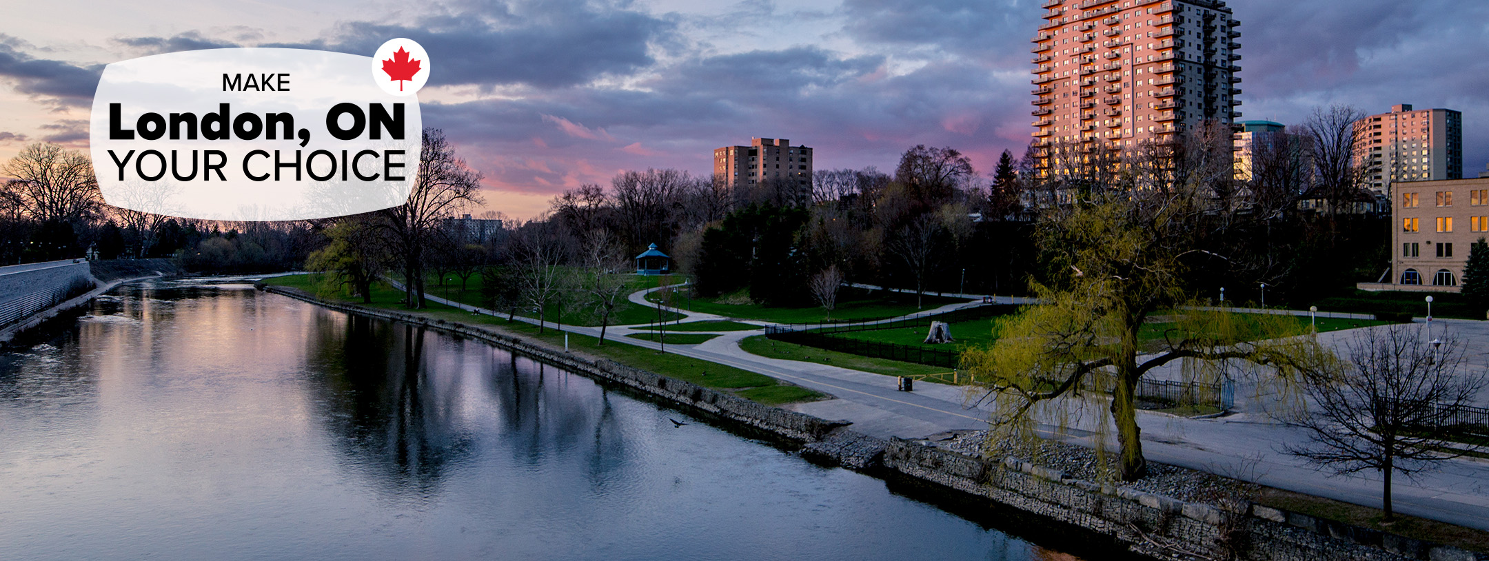 An image of the Thames river running through downtown London as the sun rises in the background.